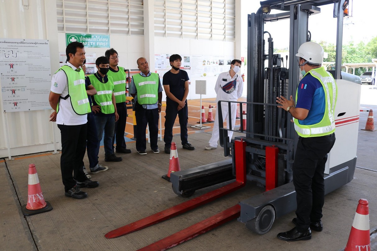 Trainees observing a forklift instructor at the A.N.I. training center