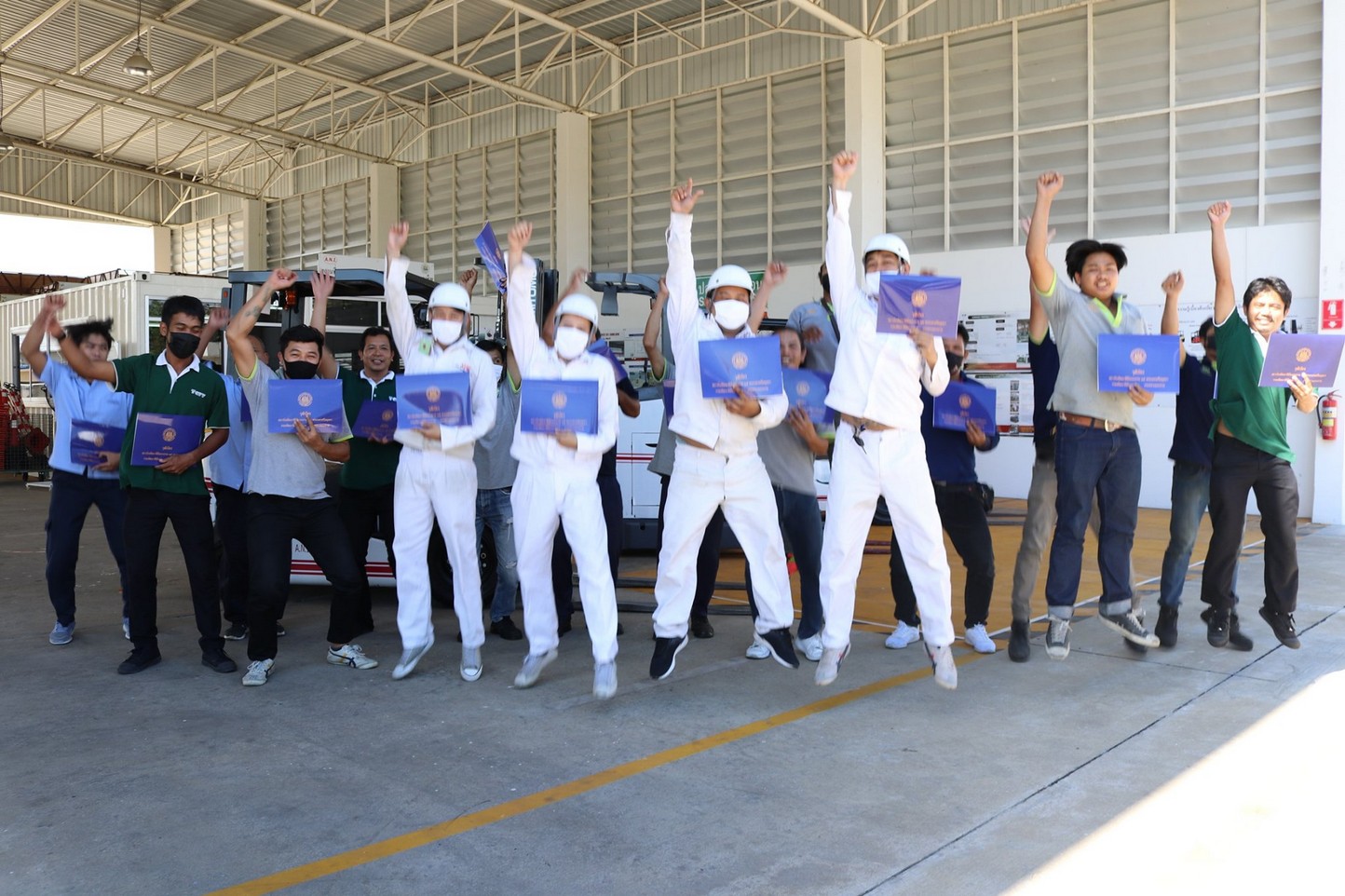 Trainees celebrating with certificates at the A.N.I. training center